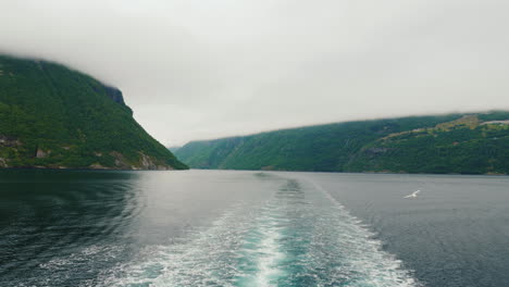 view from the stern of the ship to the picturesque norwegian fjord the majestic nature of norway a c