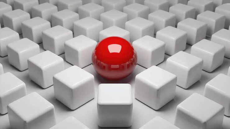 Red Sphere Standing Out Among White Cubes