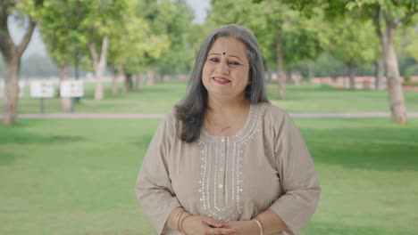 Happy-Indian-old-woman-smiling-in-park