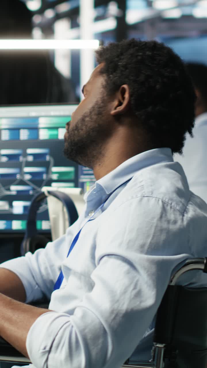 Vertical Video Man In Wheelchair Dissatisfied With Server Farm Ai Analytics Metrics