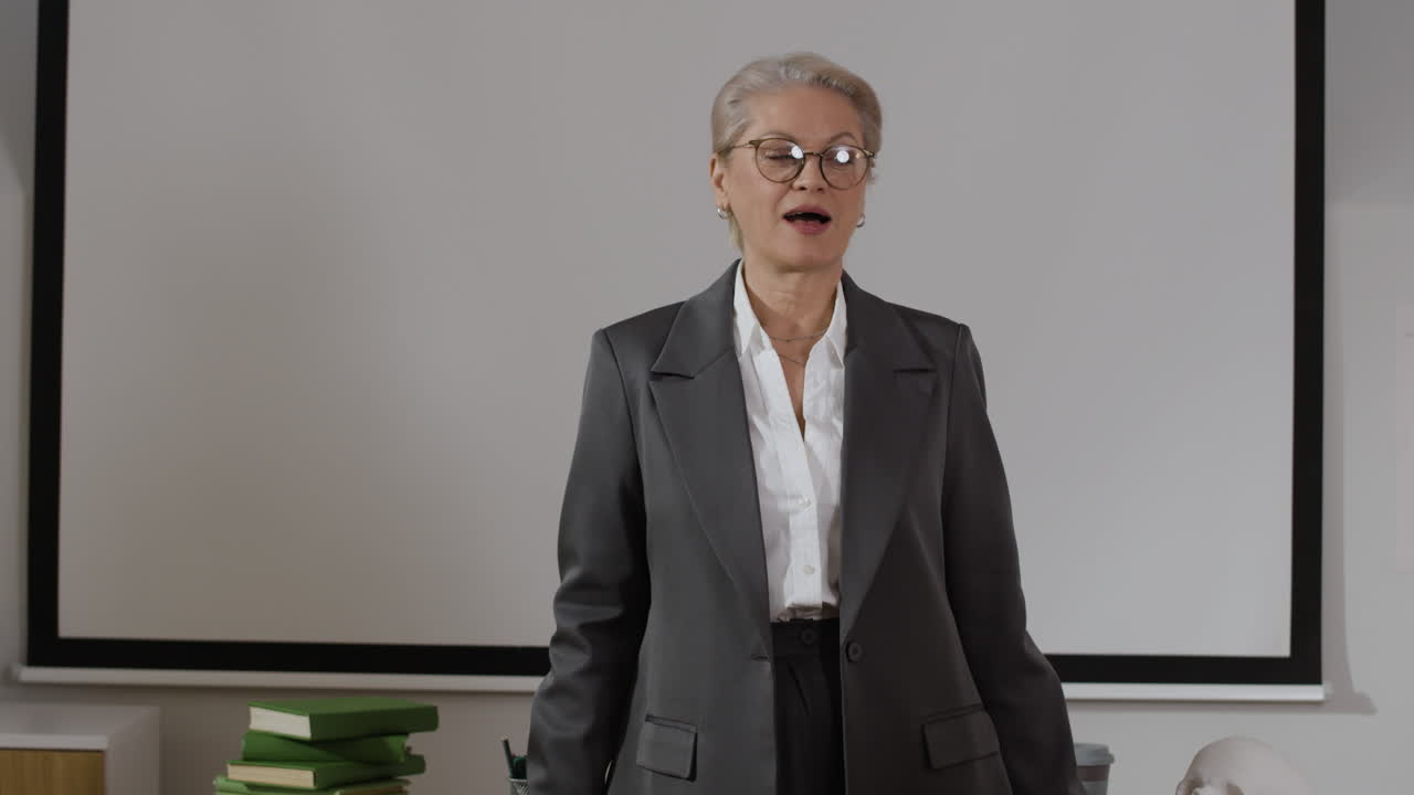 A teacher in a classroom giving a presentation