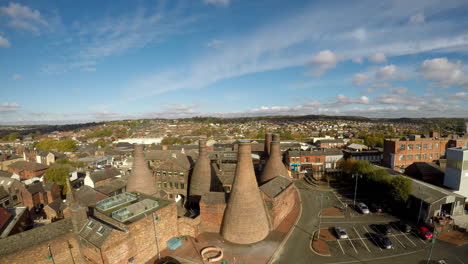 aerial footage, view of the famous bottle kilns at gladstone pottery museum in stoke on trent, pottery manufacturing, industrial decline and vacant businesses