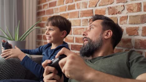 close up video of father and son playing video game