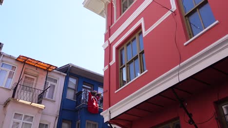 old buildings with balconies in a narrow street