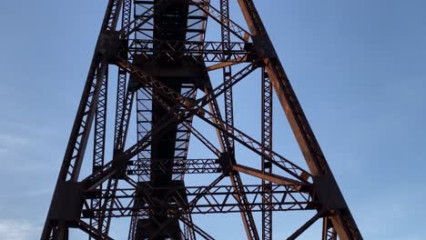 a beautiful, high, steel, beautifully engineered train bridge viaduct in the appalachian mountains during early spring at sunset