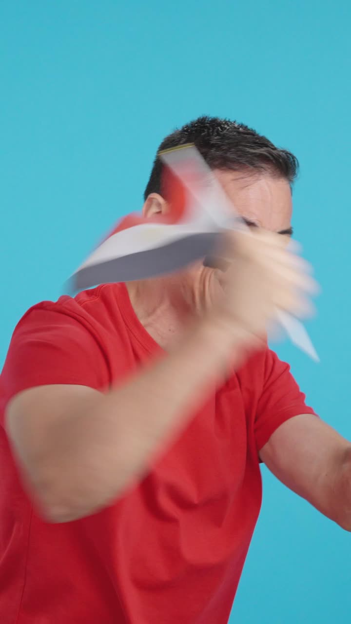 Man cheering for Egypt waving a national flag looking away