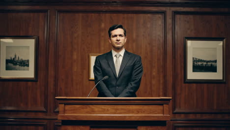 businessman giving a speech at a podium