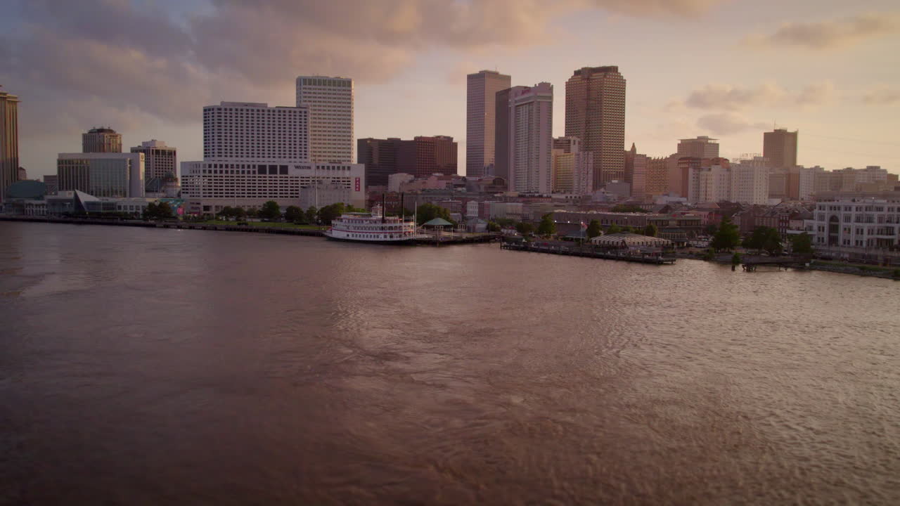 Aerial fly up from the Mississippi River over New Orleans