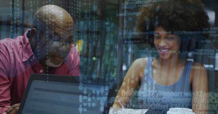 Diverse Colleagues Collaborating on Data Analysis in Modern Office