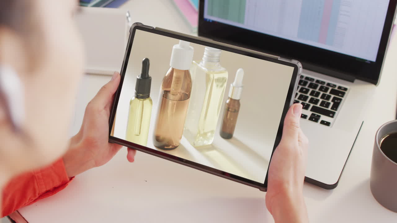 Caucasian woman using tablet, online shopping for beauty products, slow motion