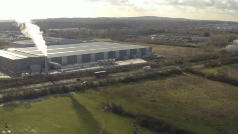 aerial drone view of industry factory chimney and major road with scrap metal business