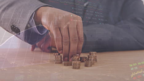 animation of graphs, trading boards over caucasian man looking looking at coins on table