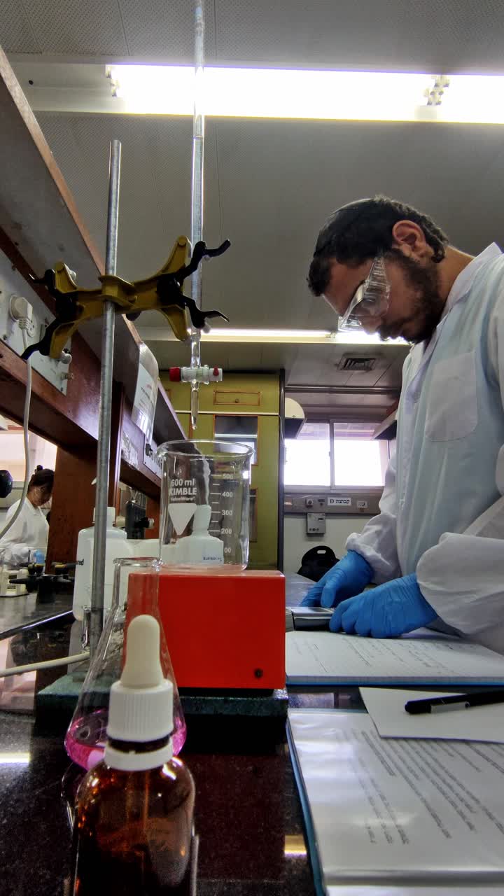 Student Conducting Experiment in Chemistry Lab