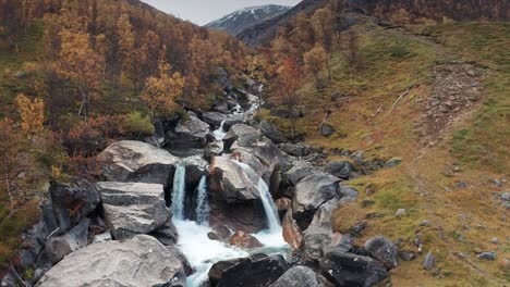 Aerial-view-of-the-wild-river-cascading-through-the-narrow-rocky-canyon