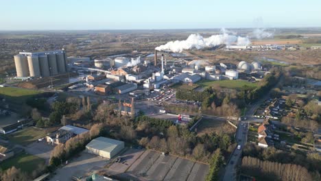 bury st edmunds with industrial complex and smokestacks, clear day, aerial view