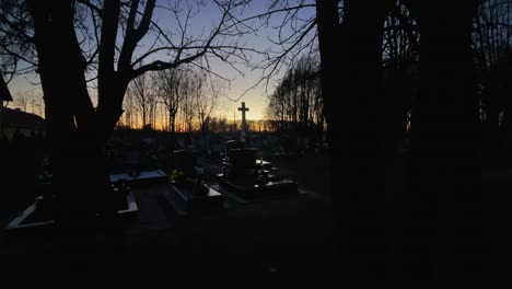 Graveyard-Christian-in-evening-with-cross-fish-eye-wide,-Mosonmagyarovar,-Hungary