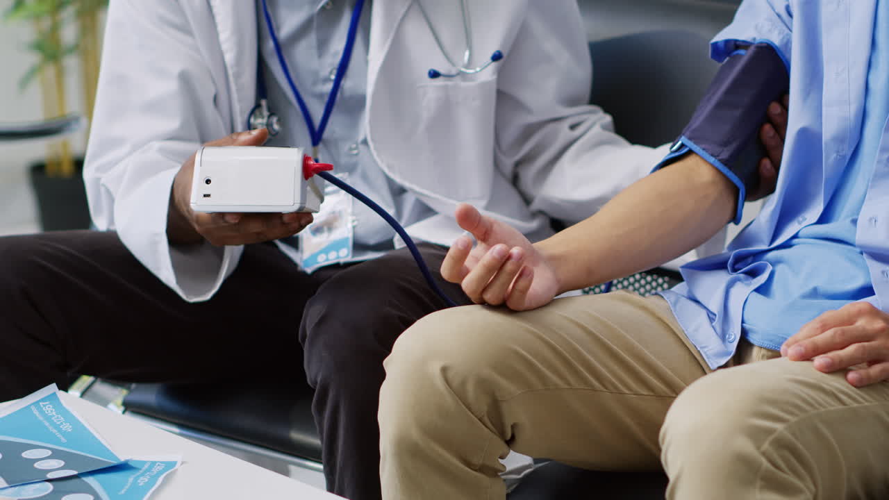 Doctor Checking Patient's Blood Pressure