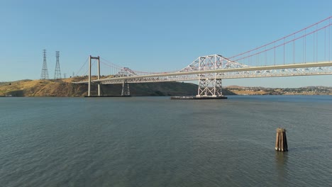 tranquil skies frame the alfred zampa bridge from above, with sweeping shots revealing the bridge’s elegant structure against crockett’s historic waterfront