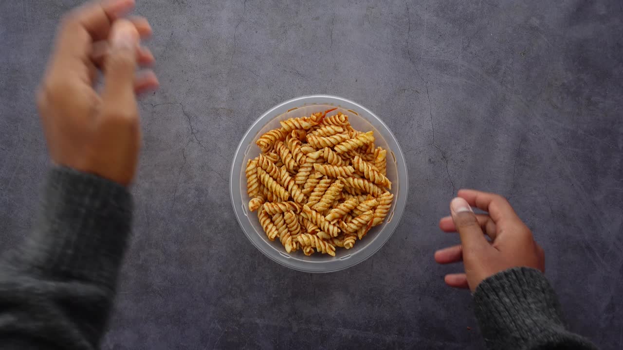 Bowl of fusilli pasta with tomato sauce