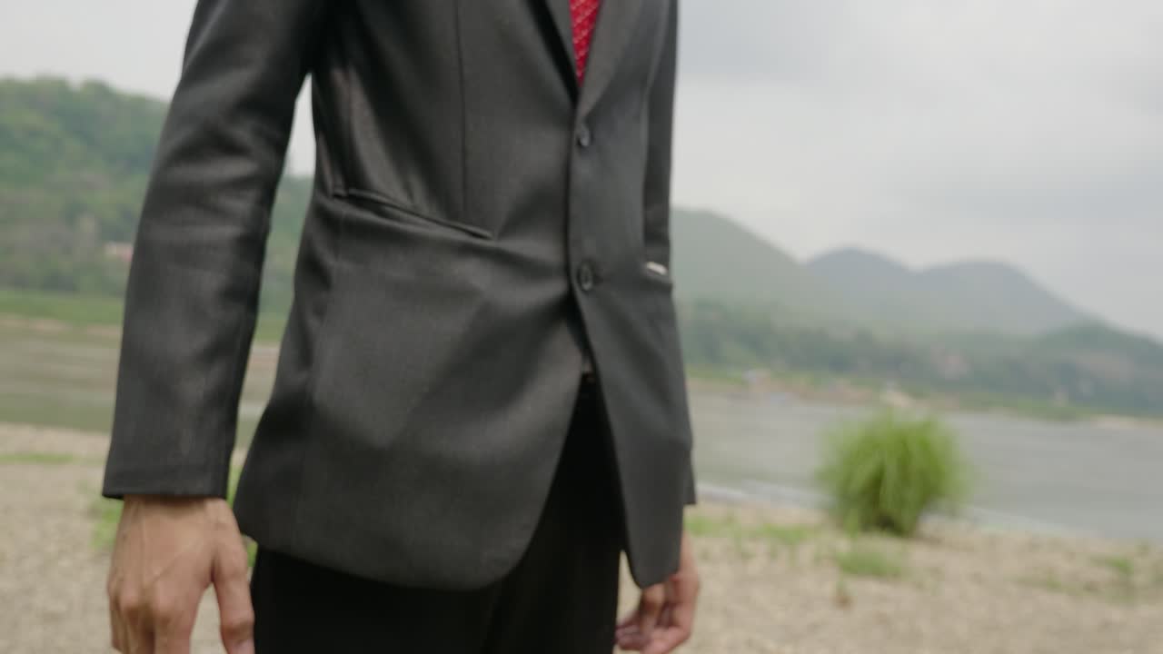 Businessmen Handshake by the River