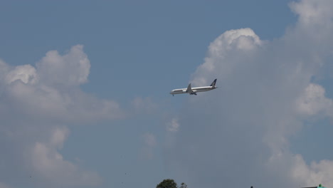 singapore airlines flight coming in for landing at the tribhuvan international airport in kathmandu, nepal