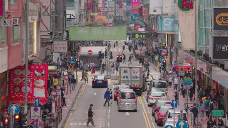 busy street, crowd market in the famous shopping area in sai yeung choi street, mong kok, hong kong. during covid-19 period