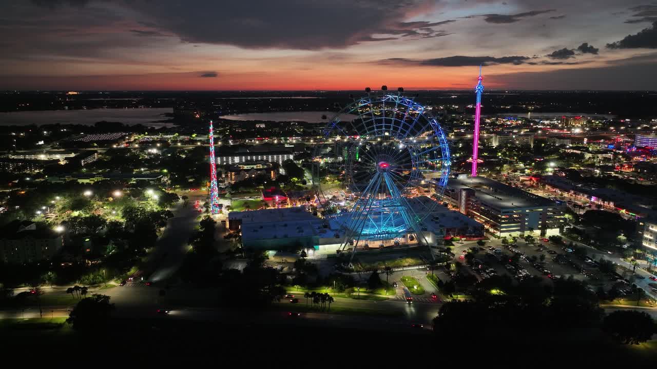 Night View Of The Iconic Ferris Wheel At ICON Park In Orlando, Florida, United States. Aerial Wide Shot