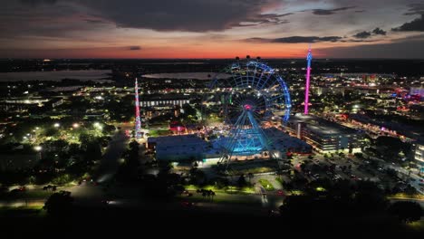 night view of the iconic ferris wheel at icon park in orlando, florida, united states. aerial wide shot