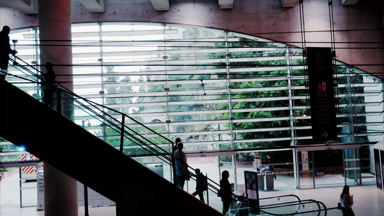 Monte Carlo, Monaco - October 4, 2024: People on the escalator in the Monaco train station