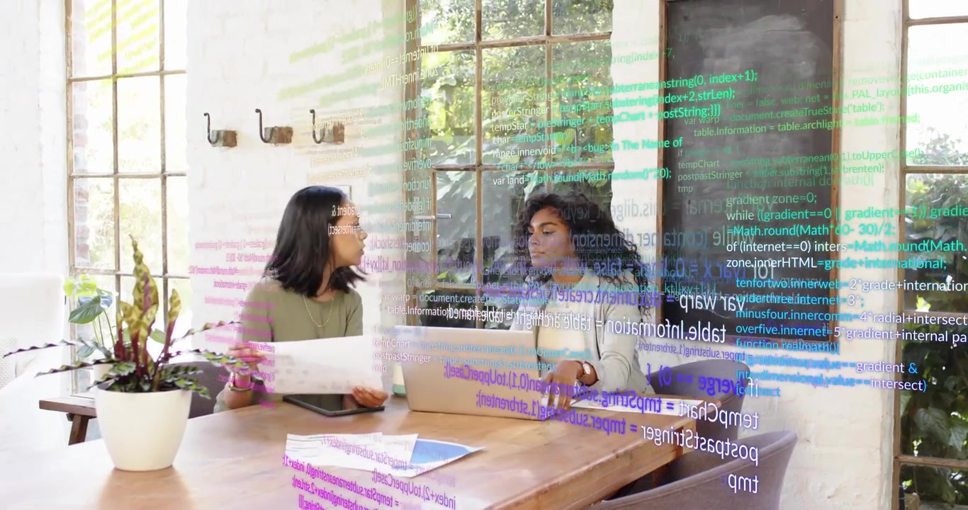 Project lead showing tablet drafts to developer at home desk animated notes refining design details