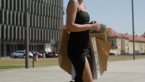 young fashionable african woman walking down the street