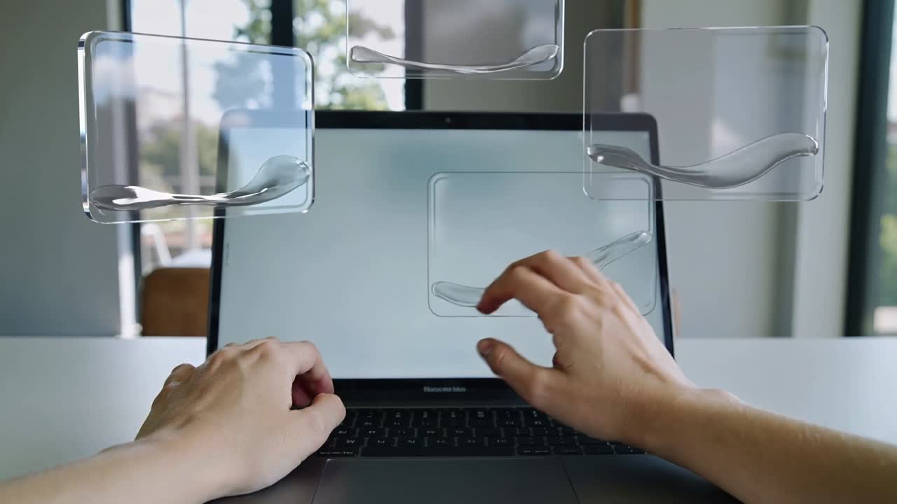 Panels appearing, adult hands tapping and dragging on open laptop at desk, adjusting ribbon element