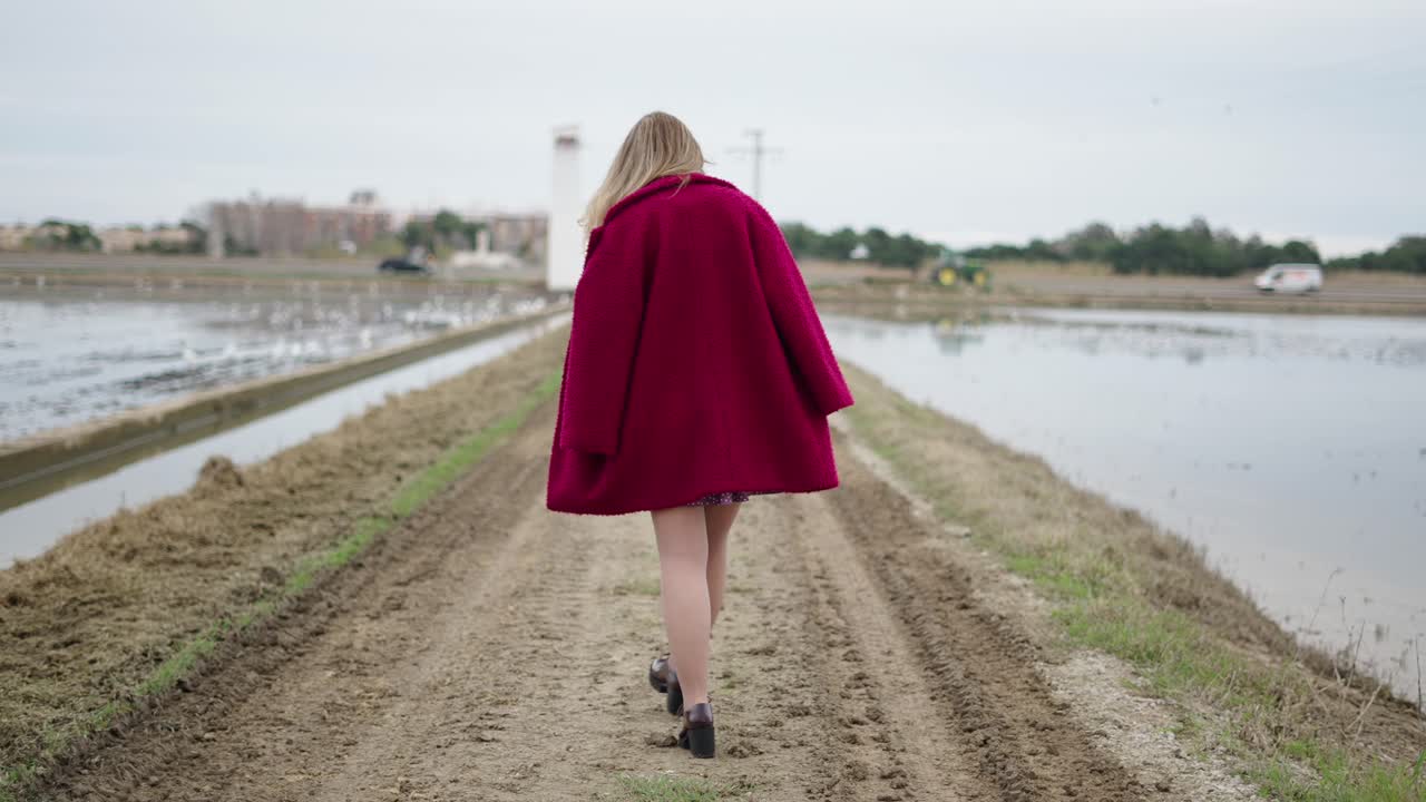 Woman walking in a rural landscape