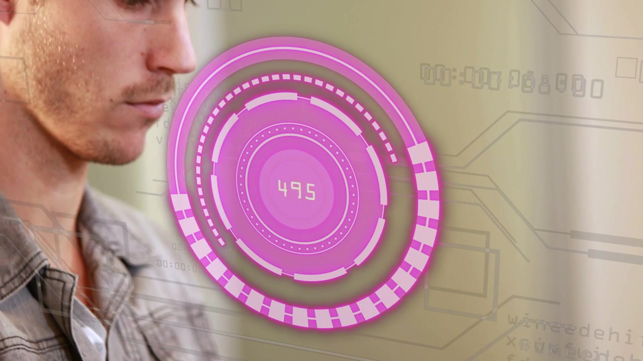 Man typing on laptop, tech HUD appearing, tracking numbers and aligning over eye while monitoring