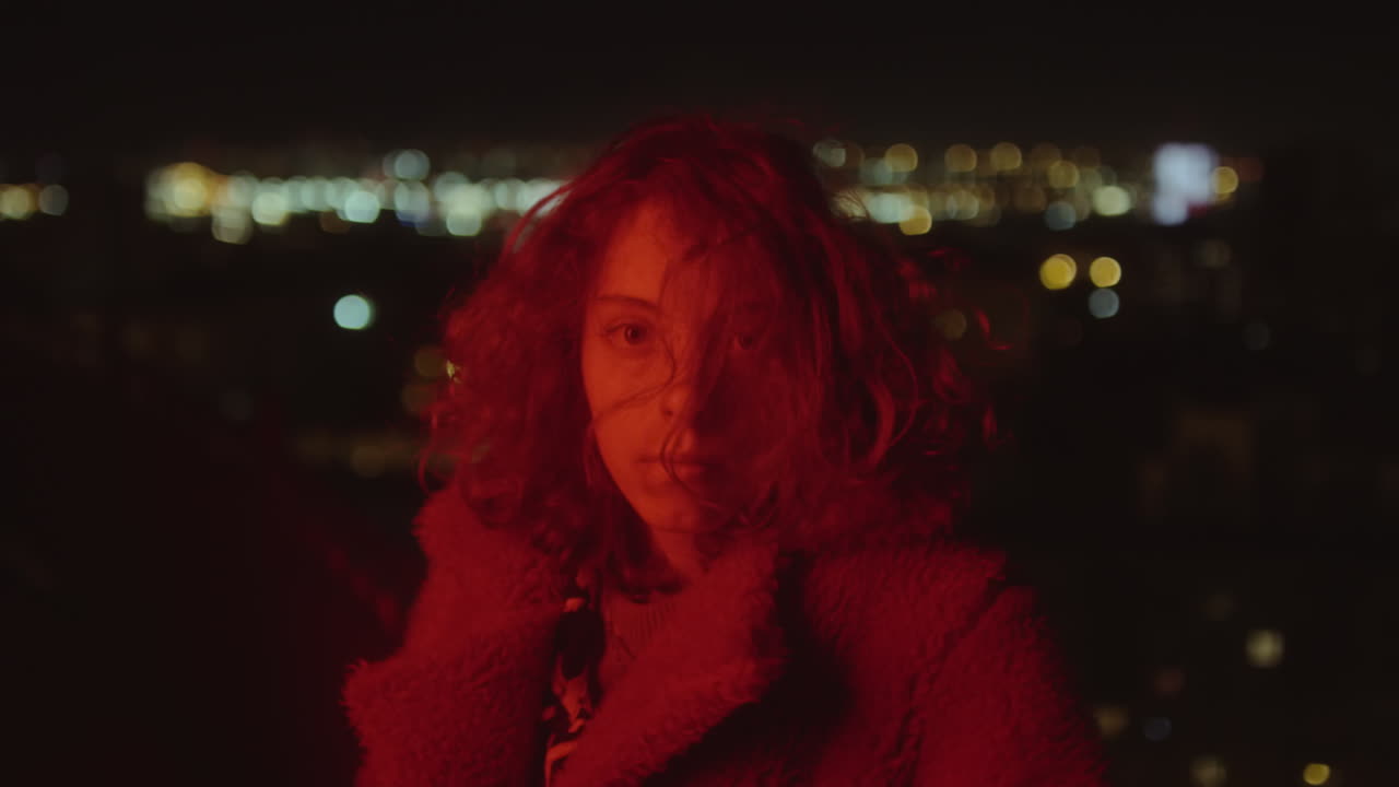 Portrait of Girl in Red Light at Night