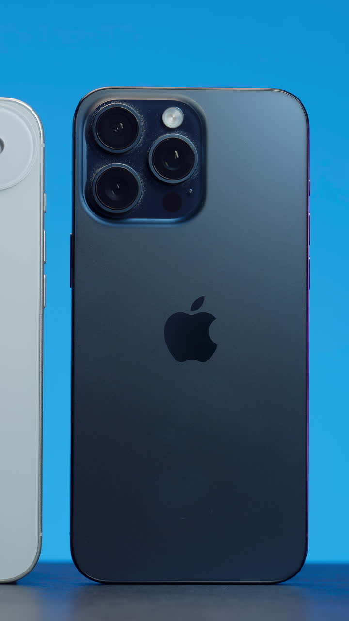 Close-up of iPhones on a blue background