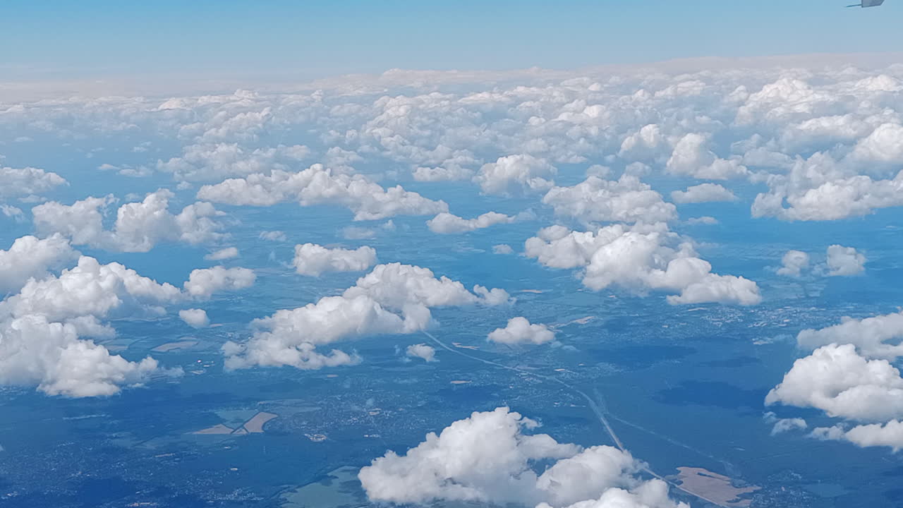 Beautiful clouds and horizon from an airplane window