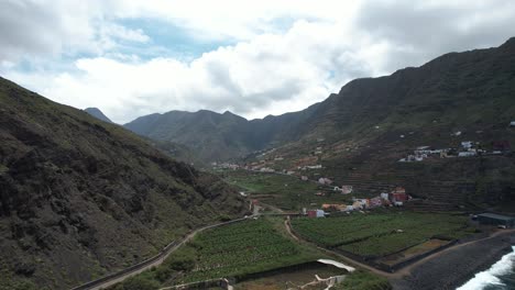 A-Bird's-Eye-View-of-Hermigua,-Framed-by-the-Peaks-of-La-Gomera,-Canary-Islands,-Spain