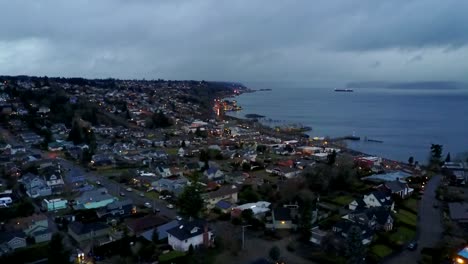 dark storm clouds over the peaceful city of tacoma, washington - aerial