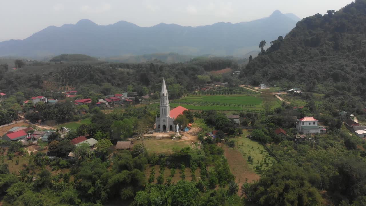 Aerial view of Gi&aacute;o Xứ Bạch Xa Catholic Church With A Greenery Surrounded Farm
