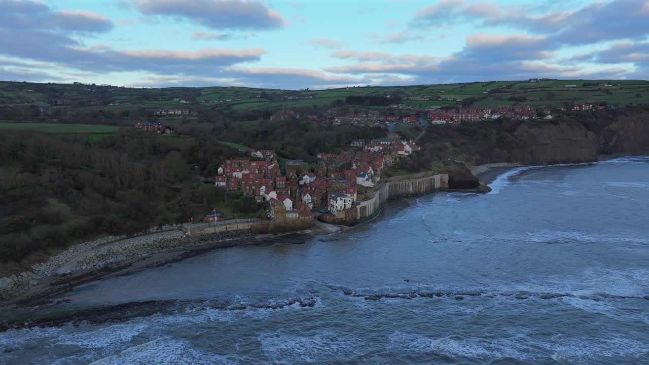 Wide Angle Aerial Shot of Robin Hood's Bay Village on Overcast Day UK