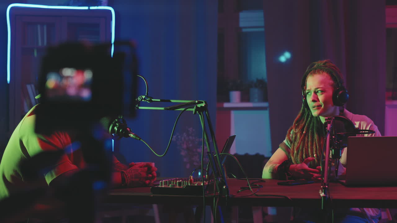 Young Man and Woman Recording Podcast Episode