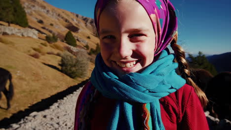 smiling girl hiking in mountains