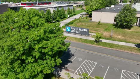 Revealing-shot-of-the-South-Seattle-College-entrance-sign-appearing-from-behind-a-tree