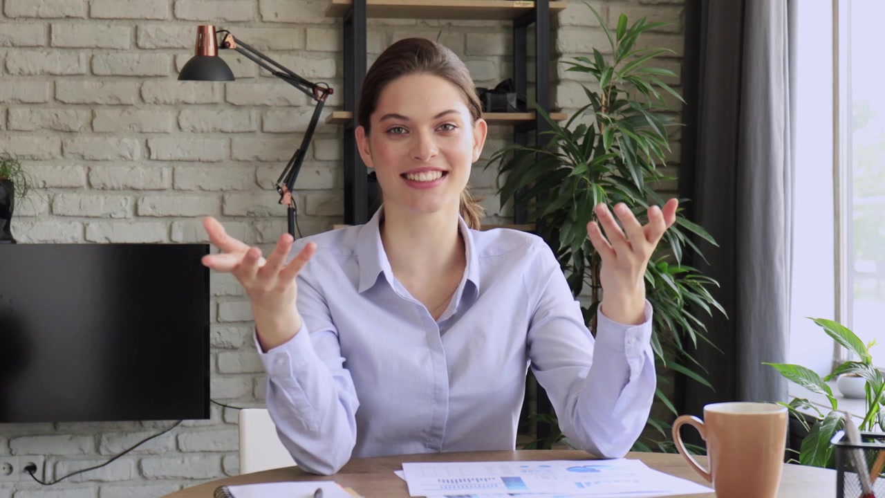 Cheerful Woman Gesturing While Talking on a Video Call
