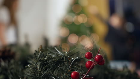 unrecognizable children dancing and decorating a christmas tree