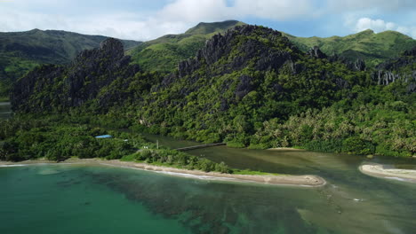 Aerial-view-of-the-the-Linderalique-rocks,-beaches-and-jungle,-in-Hienghene,-New-Caledonia---tracking,-drone-shot