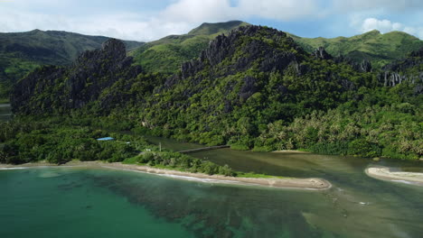 aerial view of the the linderalique rocks, beaches and jungle, in hienghene, new caledonia - tracking, drone shot