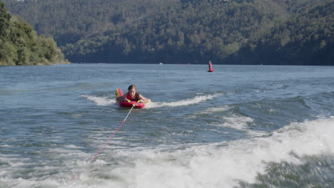 girl wakeboarding on a lake