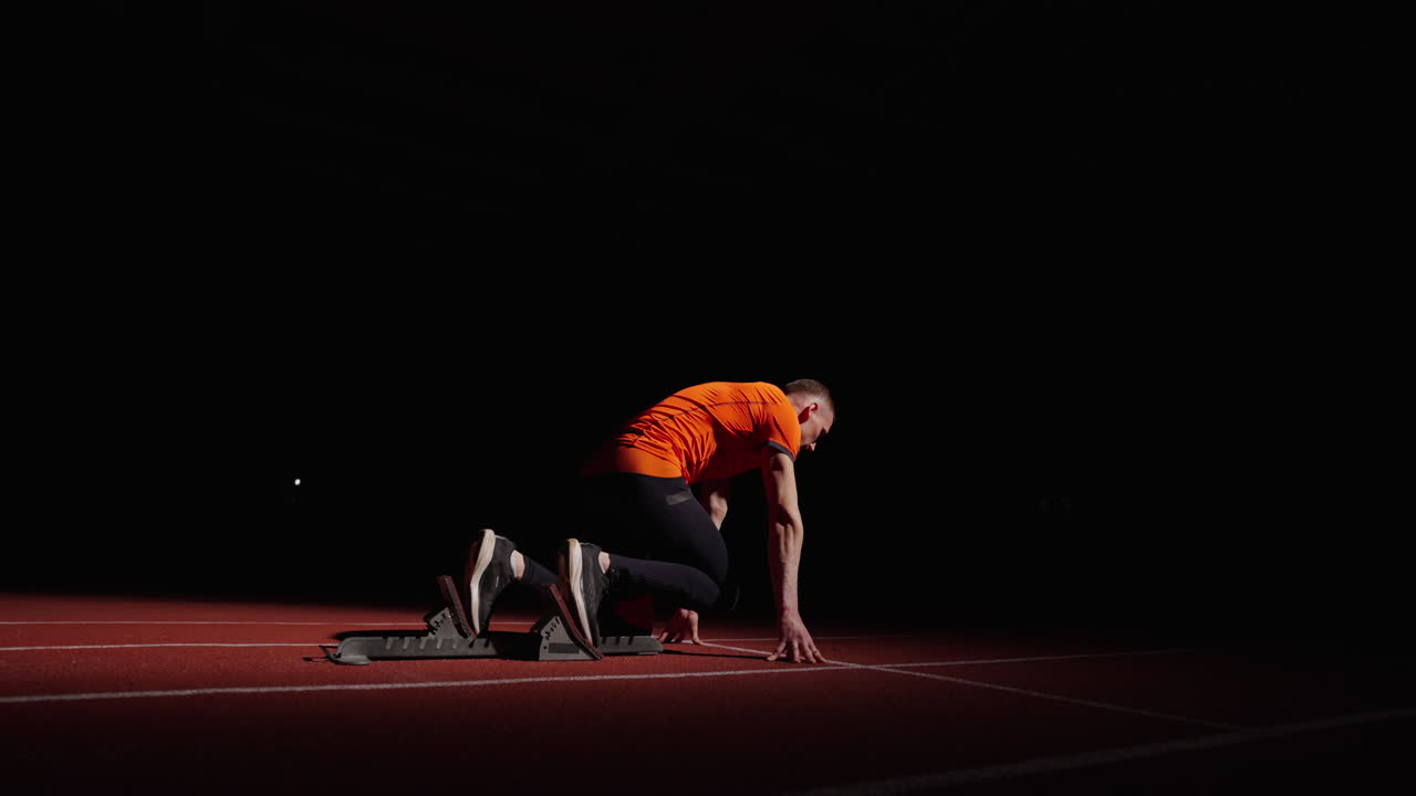 Man Ready to Sprint at Night